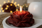 Close-up lit rose candle