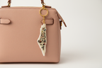 Palestinian keychain on women's bag overhead